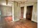 Bright living room with hardwood floors, neutral walls, and wood-paneled accent wall at 505 W 40Th St, Indianapolis, IN 46208