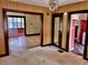 Vintage living room offering clear views into adjacent rooms and a glimpse of a bright red kitchen at 505 W 40Th St, Indianapolis, IN 46208