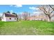 Spacious backyard with well-maintained grass, offering potential for outdoor activities and landscaping opportunities at 5196 N London Rd, Fairland, IN 46126
