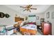 Bedroom with unique decor, a ceiling fan, and natural light, offering a cozy and personalized space at 5196 N London Rd, Fairland, IN 46126