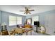 Bedroom with a ceiling fan, windows, and furniture, offering a relaxing and private space at 5196 N London Rd, Fairland, IN 46126