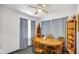 Inviting dining room space with natural light and comfortable seating under a ceiling fan at 5196 N London Rd, Fairland, IN 46126