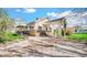 Exterior view of the house with stone accents, covered entrance, and gravel driveway at 5196 N London Rd, Fairland, IN 46126