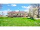 Charming single-story home with stone accents, a front porch, and a well-maintained lawn at 5196 N London Rd, Fairland, IN 46126