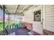 View of cozy front porch with seating area, stone accents, and covered entrance at 5196 N London Rd, Fairland, IN 46126
