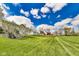 Large backyard, showing a lush green lawn and mature trees at 5397 Ripplingbrook Way, Carmel, IN 46033