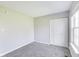 Carpeted bedroom offers a closet, neutral paint, and window at 5397 Ripplingbrook Way, Carmel, IN 46033