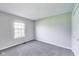 Neutral bedroom featuring a window, closet, and neutral paint at 5397 Ripplingbrook Way, Carmel, IN 46033