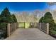 A wood deck overlooks a green lawn and trees, offering an ideal outdoor space at 5397 Ripplingbrook Way, Carmel, IN 46033