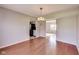 Open dining room with hardwood floors, chandelier lighting, and seamless access to kitchen at 5397 Ripplingbrook Way, Carmel, IN 46033