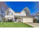 Charming two-story home featuring a well-maintained lawn and attached two-car garage at 5397 Ripplingbrook Way, Carmel, IN 46033
