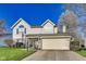 Charming two-story home featuring a well-maintained lawn and attached two-car garage at 5397 Ripplingbrook Way, Carmel, IN 46033