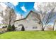 Exterior view of a home with mature trees and a lush green lawn at 5397 Ripplingbrook Way, Carmel, IN 46033