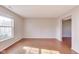 Bright and spacious living room with hardwood floors and large windows for ample light at 5397 Ripplingbrook Way, Carmel, IN 46033