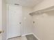 Mud Room featuring a coat rack, storage shelf, and utility connections at 5397 Ripplingbrook Way, Carmel, IN 46033
