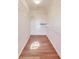 A walk-in closet is well-lit with hardwood flooring and wire shelving at 5397 Ripplingbrook Way, Carmel, IN 46033