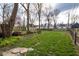 Green backyard with outdoor seating and a fire pit perfect for entertaining and relaxation at 5654 Broadway St, Indianapolis, IN 46220