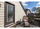 Relaxing balcony featuring a lounge chair, small table, and exterior view at 5654 Broadway St, Indianapolis, IN 46220
