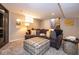 Cozy basement with plush seating, warm lighting and carpeted floors at 5654 Broadway St, Indianapolis, IN 46220