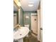 Bathroom with a tile shower, new vanity, and natural light at 5654 Broadway St, Indianapolis, IN 46220