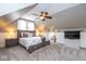 Bedroom showcasing a bed, carpet, and sloped ceilings at 5654 Broadway St, Indianapolis, IN 46220