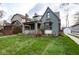 Beautiful home showcasing its unique architectural style, covered porch, and inviting curb appeal at 5654 Broadway St, Indianapolis, IN 46220