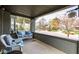 Inviting front porch with comfortable seating and a view of the neighborhood, offering a relaxing outdoor space at 5654 Broadway St, Indianapolis, IN 46220