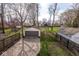 A well-maintained garage with lush green grass and mature trees surrounding the property at 5654 Broadway St, Indianapolis, IN 46220