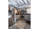 Well-equipped kitchen with grey cabinets, stainless steel appliances and decorative tile flooring at 5654 Broadway St, Indianapolis, IN 46220