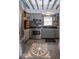 Updated kitchen with gray cabinets, stainless steel appliances and a decorative floor tile at 5654 Broadway St, Indianapolis, IN 46220