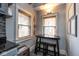 Cozy kitchen nook with natural light, a breakfast table, and stylish window treatments at 5654 Broadway St, Indianapolis, IN 46220