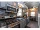 Updated kitchen with granite countertops, stainless steel appliances and a mosaic backsplash at 5654 Broadway St, Indianapolis, IN 46220