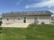 Backyard view showcasing the lawn area and the home's exterior at 600 Fairlane Dr, Edinburgh, IN 46124