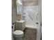 Bathroom featuring white vanity, medicine cabinet, and accessible shower with grab bars for convenience at 600 Fairlane Dr, Edinburgh, IN 46124