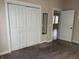 Bedroom with neutral walls, carpet, white closet and door frames at 600 Fairlane Dr, Edinburgh, IN 46124