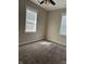 Bedroom with neutral walls, carpet, and natural light from windows at 600 Fairlane Dr, Edinburgh, IN 46124