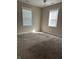 Bright bedroom with carpet flooring and two windows offering ample natural light and a comfortable space at 600 Fairlane Dr, Edinburgh, IN 46124