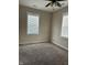 Bedroom with neutral walls, carpet, and natural light from windows at 600 Fairlane Dr, Edinburgh, IN 46124