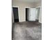 Bedroom with carpet floors, neutral walls, two closets and two doors leading to other rooms at 600 Fairlane Dr, Edinburgh, IN 46124