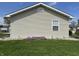 Charming home with light siding, manicured lawn, and vibrant purple flower beds at 600 Fairlane Dr, Edinburgh, IN 46124