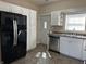 Well lit kitchen featuring stainless steel appliances, white cabinets and tile flooring at 600 Fairlane Dr, Edinburgh, IN 46124