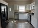 Modern kitchen featuring stainless steel appliances, granite countertops and white cabinetry at 600 Fairlane Dr, Edinburgh, IN 46124