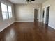 Large living room with hardwood floors, ample natural light, and access to other rooms at 600 Fairlane Dr, Edinburgh, IN 46124