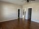 Bright, open living room with hardwood flooring and multiple doorways at 600 Fairlane Dr, Edinburgh, IN 46124
