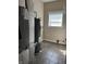 Functional utility room featuring a water heater, HVAC system, and window providing natural light at 600 Fairlane Dr, Edinburgh, IN 46124