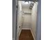 Walk-in closet featuring ample shelving, hanging space and wood flooring for organized storage at 600 Fairlane Dr, Edinburgh, IN 46124