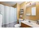 Bathroom featuring a vanity, mirror, toilet and tub with shower curtain at 617 Kokomo Ln, Indianapolis, IN 46241