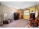 This bedroom has a personal sauna, neutral carpet, and yellow walls at 617 Kokomo Ln, Indianapolis, IN 46241