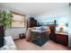 Bedroom featuring a window, neutral carpet, two-tone paint and wooden furniture at 617 Kokomo Ln, Indianapolis, IN 46241