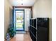 Bright entryway featuring a blue front door, laminate flooring, and neutral wall colors at 617 Kokomo Ln, Indianapolis, IN 46241